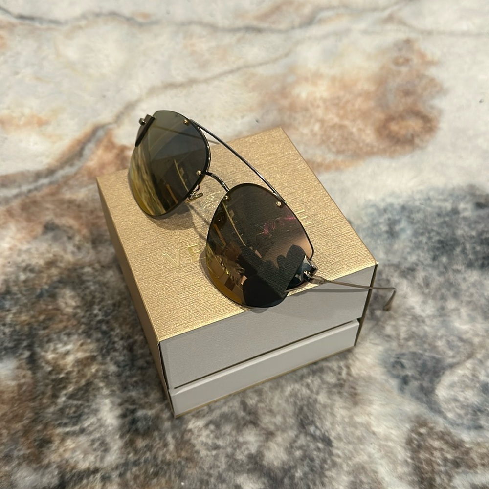 Christian Dior women’s roles, gold mirror sunglasses